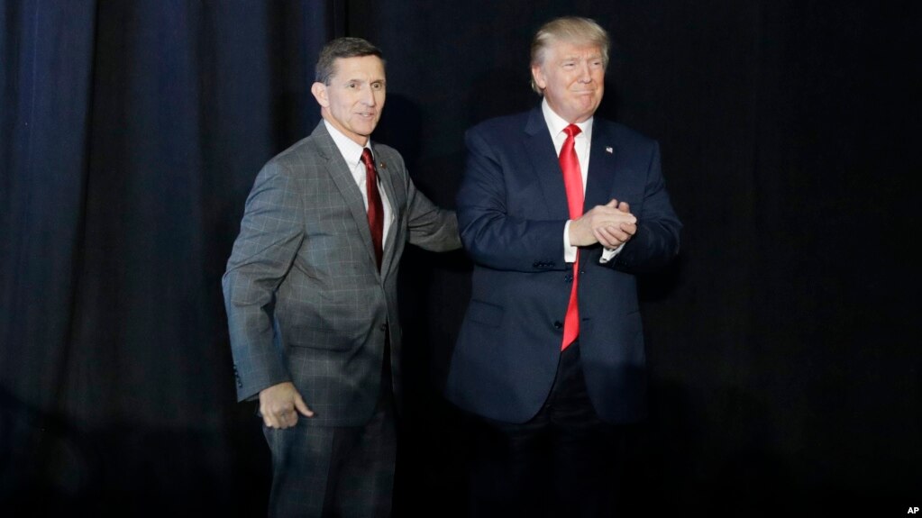 FILE - Retired Gen. Michael Flynn, left and President Donald Trump at rally. 