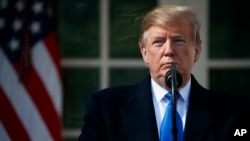 President Donald Trump speaks during an event in the Rose Garden at the White House to declare a national emergency in order to build a wall along the southern border, Feb. 15, 2019, in Washington. 