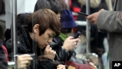 In 2012, South Korea’s government estimated that 2.55 million people are addicted to smartphones. (AP Photo/Ahn Young-joon)