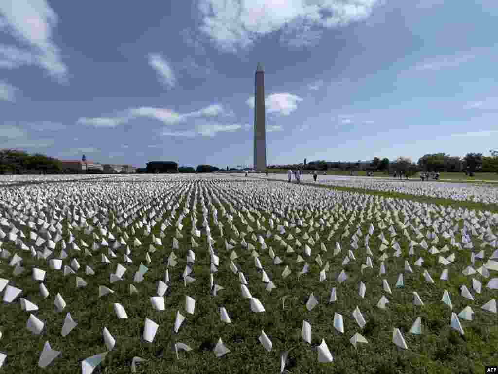 White flags are seen on the National Mall near the Washington Monument in Washington, D.C.,&nbsp; Sept. 19, 2021.