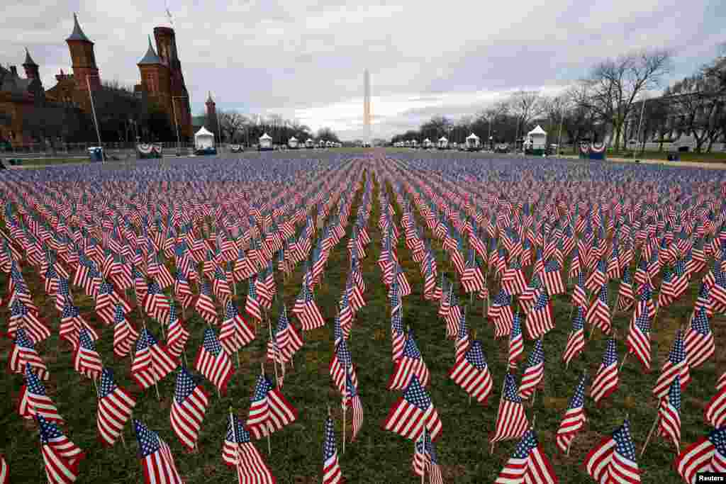 Thousands of U.S. flags are seen at the National Mall, as part of a memorial paying tribute to the U.S. citizens who have died from the COVID-19, near the Capitol ahead of President-elect Joe Biden&#39;s inauguration, in Washington, D.C.