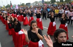 Women protest violence against women in Lima, Peru, Nov. 25, 2017.