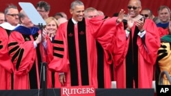 President Barack Obama waves as he arrives to deliver a commencement address at Rutgers graduation ceremonies, May 15, 2016, in Piscataway, New Jersey. 