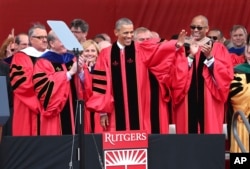 President Barack Obama waves as he arrives to deliver a commencement address at Rutgers graduation ceremonies, May 15, 2016, in Piscataway, N.J.