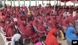 FILE - In this photo taken on Thursday, Dec. 19, 2013. Nigerian Muslim brides attends a mass wedding in Kano, Nigeria.