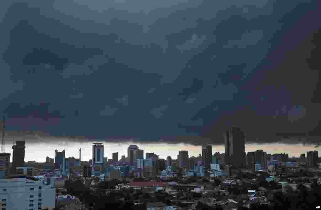 Ominous storm clouds hover over the main business district prior to a downpour in Jakarta, Indonesia.