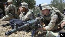 U.S. soldiers of the 82nd Airborne aim at the entrance to a cave outside the village of Malakay, Afghanistan (FILE).