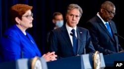 Australian Foreign Minister Marise Payne, left, accompanied by US Secretary of State Antony Blinken, second from right, and US Defense Secretary Lloyd Austin, right, speaks at a news conference at the State Department in Washington, Sept. 16, 2021. 