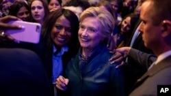 Democratic presidential candidate Hillary Clinton takes a photograph with a member of the audience after speaking at a Women for Hillary fundraiser at the Hyatt Regency in Washington, Oct. 5, 2016. Clinton's campaign is now actively mobilizing women.