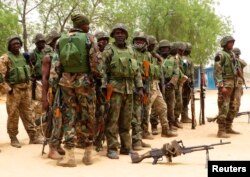 Nigerian soldiers are seen on the outskirts of Maiduguri in Borno state, May 13, 2013.