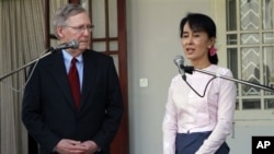 US Senator Mitch McConnell, left, listens to Burmese pro-democracy leader Aung San Suu Kyi in Rangoon, Burma Jan. 16, 2012.