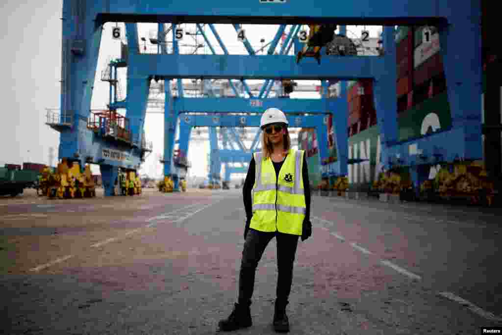 Liz Azoulay, 26, who loads and unloads cargo at Ashdod port, poses for a photograph at the port, in Ashdod, southern Israel, Feb. 22, 2017. &quot;In most of my professional life I did not face any inequality. In the port of Ashdod we are equal on the docks. I am the first woman who began working at the Ashdod port as a stevedore.&quot;