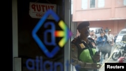 A policeman is seen outside the club where police detained 141 men for what they described as a gay prostitution ring, in Jakarta, Indonesia, May 23, 2017. 