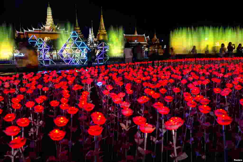 People attend an Art and Cultural Performance in celebration of the Royal Coronation Ceremony at The Grand Palace in Bangkok, Thailand.