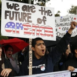 Undocumented college student Jorge Herrera, 18, center, of Carson, California, rallies with students and Dream Act supporters in Los Angeles, 18 Dec 2010