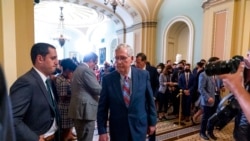 FILE - Senate Minority Leader Mitch McConnell, R-Ky., walks away after speaking with reporters as work continues on the Democrats' Build Back Better Act, massive legislation that is a cornerstone of President Joe Biden's domestic agenda, at the Capitol, i