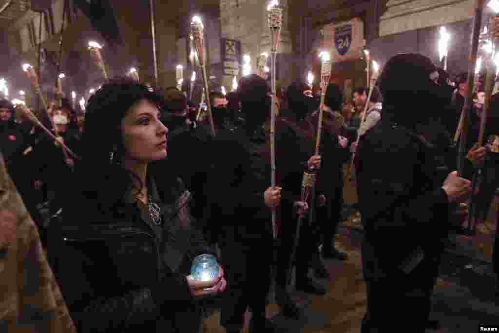 Members and supporters of Ukrainian far-right radical groups take part in a torchlight procession to commemorate people killed during protest rallies held by Euromaidan movement, Kyiv, April 29, 2014.