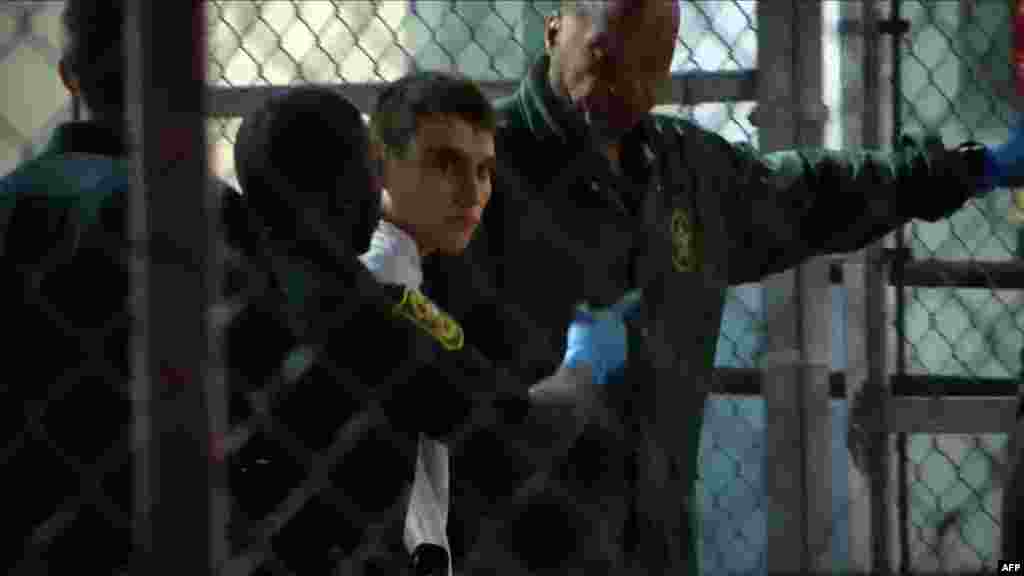This video screen grab image shows shooting suspect Nikolas Cruz at Broward County Jail in Ft. Lauderdale, Florida, Feb. 15, 2018. The heavily armed teenager who gunned down students and adults at a Florida high school was charged with 17 counts of premeditated murder, court documents showed.