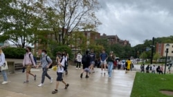 Students walking on campus near Forbes Avenue at Carnegie Mellon University.