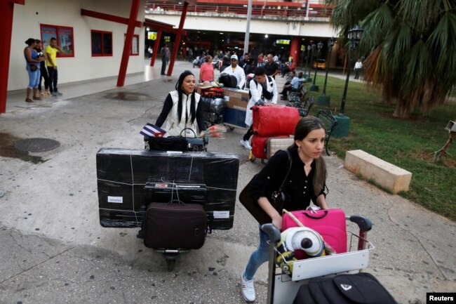 Cuban doctors leave the Jose Marti International Airport after arriving from Brazil, in Havana, Cuba, Nov. 23, 2018.