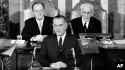 In this March 15, 1965 file photo, President Lyndon B. Johnson addresses a joint session of Congress in Washington, during which he urged the passing of the Voting Rights Act.
