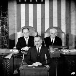 In this March 15, 1965 file photo, U.S. President Lyndon B. Johnson addresses a joint session of Congress in Washington where he urged the passing of the Voting Rights Act.