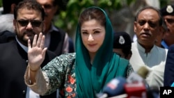 Maryam Nawaz, center, the daughter of Pakistani prime minister Nawaz Sharif, talks with media following an appearance before a panel investigating the Sharif family's offshore companies and claims of money laundering, in Islamabad, July 5, 2017.
