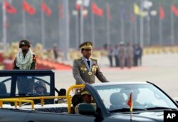 Myanmar's commander-in-chief, Min Aung Hlaing, inspects officers during a parade to commemorate Myanmar's 72nd Armed Forces Day in Naypyitaw, Myanmar, March 27, 2017.