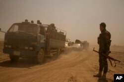 Hundreds of civilians flee villages outside Mosul a day after Iraqi Kurdish forces launched an operation east of Islamic State-held Mosul, Aug. 15, 2016.