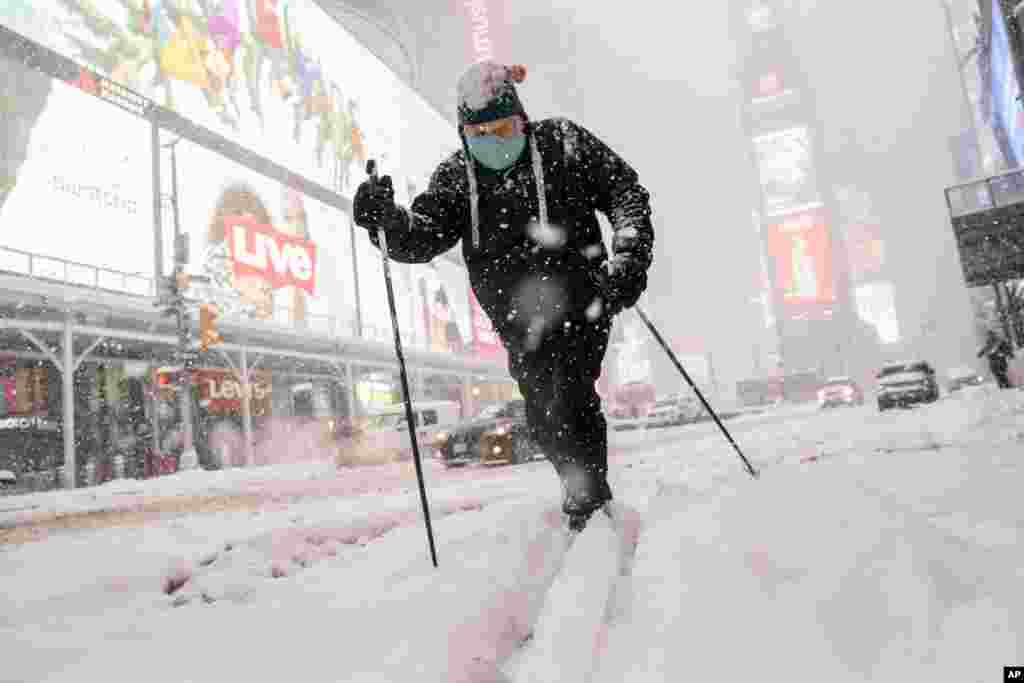 Steve Kent skis through Times Square during a snowstorm in the Manhattan borough of New York.