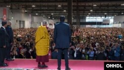 His Holiness the Dalai Lama waving to the crowd at Rho Fiera Milano