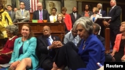 A photo shot and tweeted from the floor of the U.S. House of Representatives by Rep. Katherine Clark shows Democratic members staging a sit-in on the House floor in support of action on gun control, June 22, 2016.