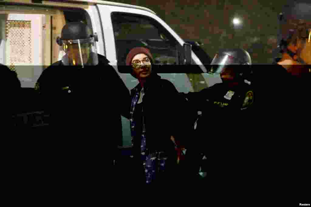 Police detain a demonstrator during a protest against the election of Republican Donald Trump as President of the United States in Portland, Oregon, Nov. 10, 2016.