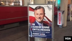 Norbert Hofer's campaign posters have been defaced, reflecting Austria's angry and divisive campaign. This one, in central Vienna, shows a mustache depicting Hofer as Hitler. (L. Ramirez/VOA)