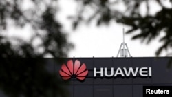 FILE - The Huawei logo is pictured outside the company's research facility in Ottawa, Ontario, Canada, Dec. 6, 2018. 