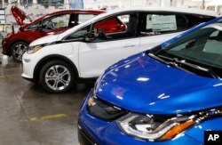 FILE - Several Chevrolet Bolt EV vehicles are shown during a tour of the General Motors Orion Assembly plant in Orion Township, Michigan, Nov. 4, 2016.