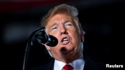 U.S. President Donald Trump speaks during a campaign rally at Southern Illinois Airport in Murphysboro, Illinois, Oct. 27, 2018.