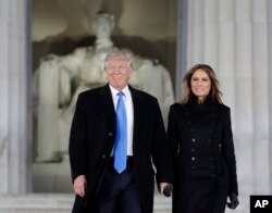 President-elect Donald Trump and his wife Melania Trump arrive at a pre-Inaugural "Make America Great Again! Welcome Celebration" at the Lincoln Memorial in Washington, Jan. 19, 2017.