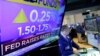 Specialist Edward Loggie works at his post on the floor of the New York Stock Exchange as the rate decision of the Federal Reserve is announced March 21, 2018.