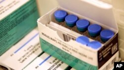 FILE -- Measles, mumps and rubella vaccines sit in a cooler at the Rockland County Health Department in Pomona, N.Y., March 27, 2019. 