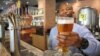 Airport Craft Brewers barman Oscar Sentane prepares to serve one of Marali's blonde lagers at the O.R. Tambo airport in Johannesburg, South Africa.