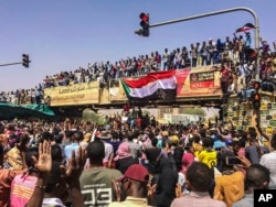 Activists behind anti-government protests in Sudan say security forces have killed at least seven people, including a military officer, in another attempt to break up the sit-in outside the military headquarters in Khartoum, April 9, 2019.