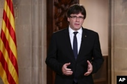 Catalan President Carles Puigdemont speaks in Barcelona, Spain, on Oct. 4, 2017. On Oct. 9, 2017, Puigdemont asked Catalan leaders to back down in their support of an independence referendum.