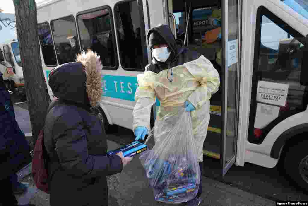 Binax Covid-19 testing kits are handed out in the Bensonhurst section of the Brooklyn area of New York City.