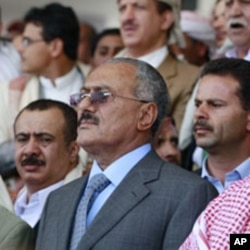 Yemen's President Ali Abdullah Saleh (C) attends a rally held by pro-government supporters in Sanaa, May 13, 2011