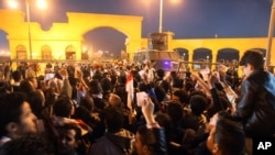 Fans of Egypt's Zamalek soccer team flock in droves outside the Air Defense Stadium to watch a match between Egyptian Premier League clubs Zamalek and ENPPI in a suburb east of Cairo, Egypt, Sunday, Feb. 8, 2015.