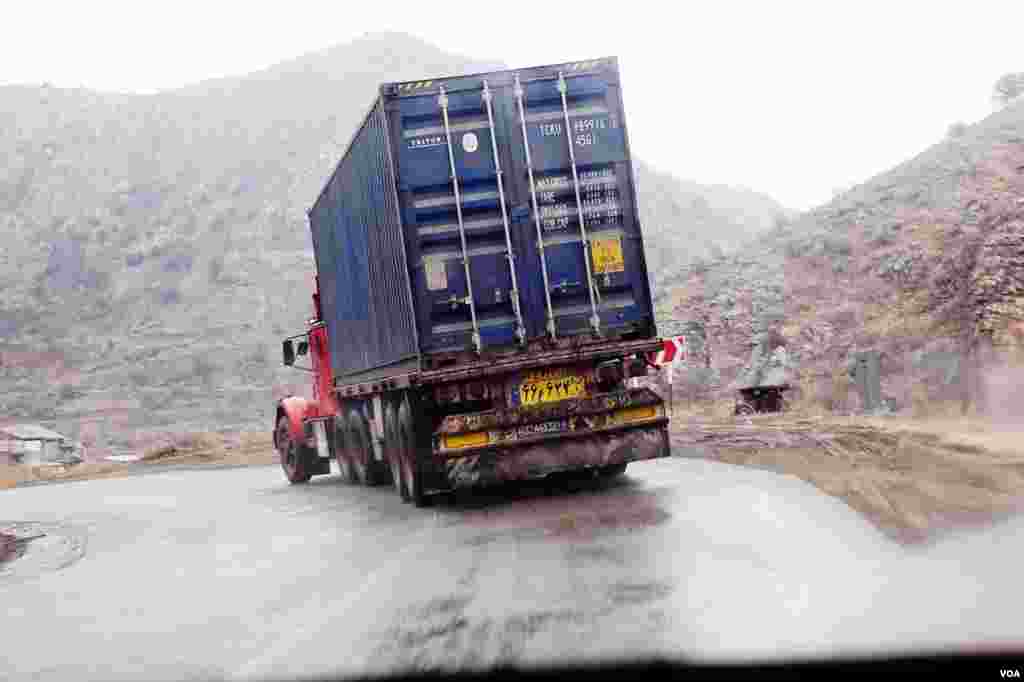 Iranian trucks drive north through Armenia's winding, mountainous roads, Feb. 21, 2013. (V. Undritz/VOA)