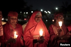 "Bring Back Our Girls" campaigners gather at a candlelight ceremony in Abuja marking the 500th day since the abduction of girls in Chibok, Nigeria, Aug. 27, 2015.