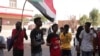 Para warga meneriakan yel-yel dalam sebuah protes di Khartoum, di tengah aksi unjuk rasa menentang kudeta militer yang terjadi Sudan, pada 4 November 2021.