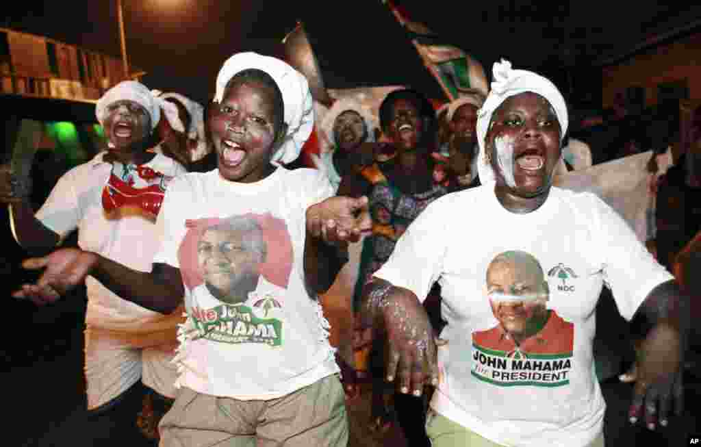 Supporters of President John Dramani Mahama celebrate in the streets after he was declared the winner of Ghana's presidential election, Accra, Ghana, December 9, 2012. 